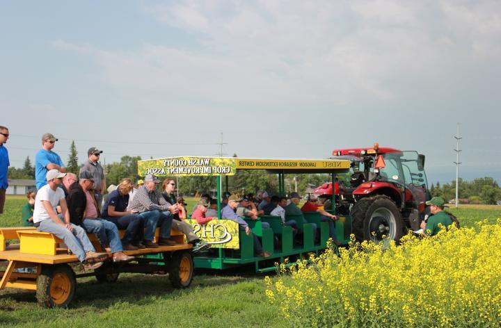 Picture of people sitting on the peoplecarriers at an annual LREC Field Day event.